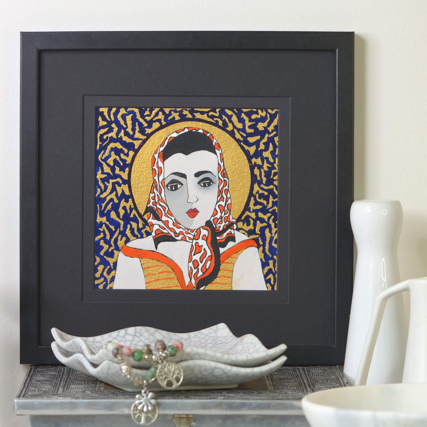 Small, original gouache painting of spiritual feminine power and beauty with golden detail by Ella Que Artist in black single mat